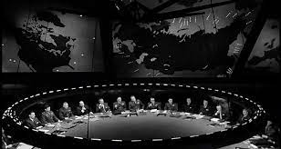 Stanley Kubrick's War Room, from Doctor Strangelove, on the right we see incoming ICBM missile trajectories, the left screen shows missile-carrying submarine (SLBM) locations.
